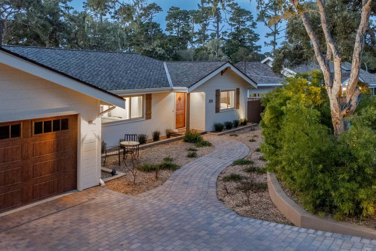 3128 Stevenson Drive Pebble Beach, CA 93953 - Photo 3 of 35 a backyard of a house with wooden fence and roof