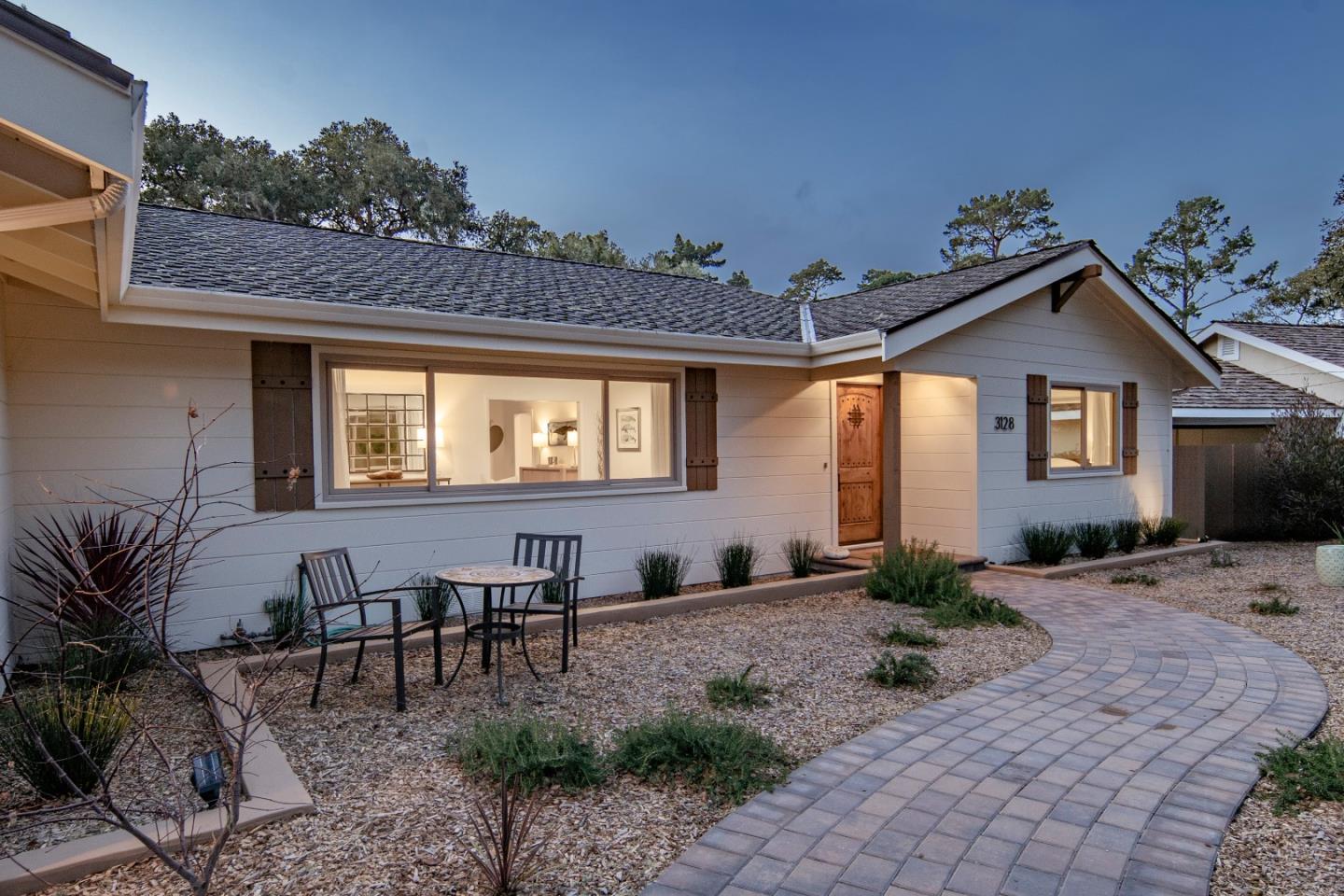 3128 Stevenson Drive Pebble Beach, CA 93953 - Photo 4 of 35 a front view of a house with garden