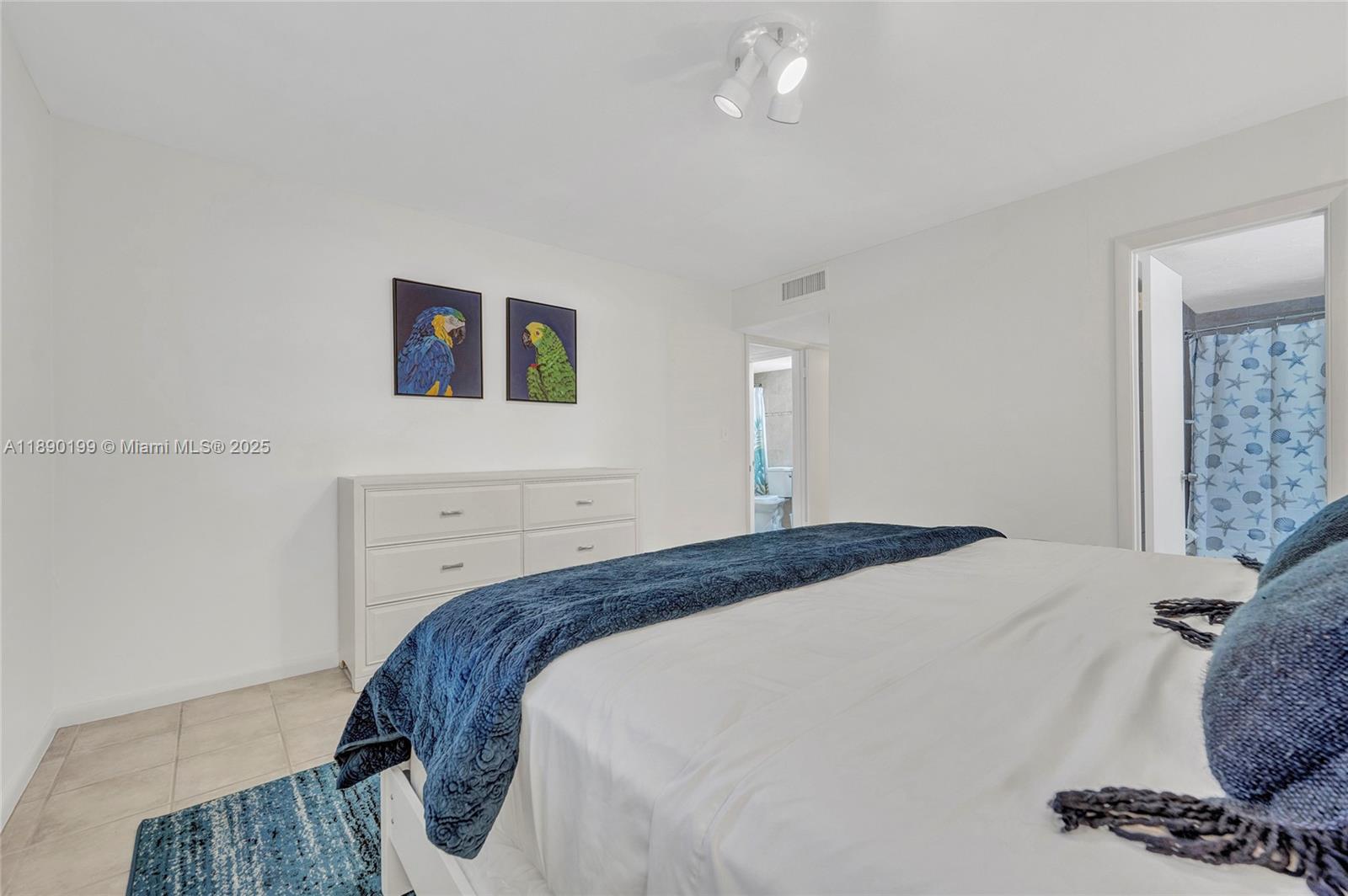 1129 Pebble Beach Lane, Unit 6 Marathon, FL 33050 - Photo 17 of 31 a bedroom with a bed and a dresser