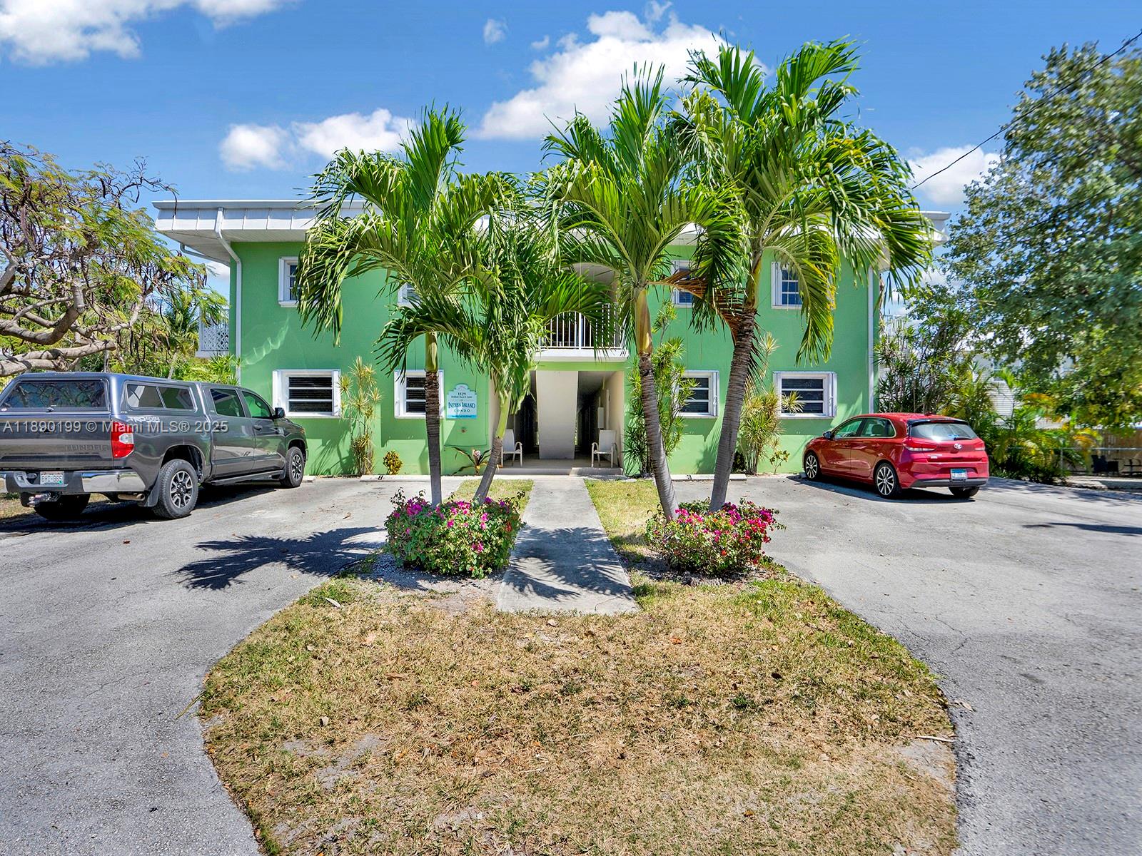 1129 Pebble Beach Lane, Unit 6 Marathon, FL 33050 - Photo 29 of 31 a cars parked in front of a house