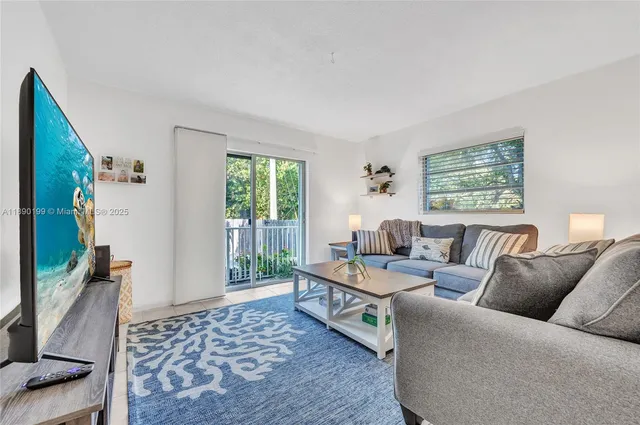 a living room with furniture and a window