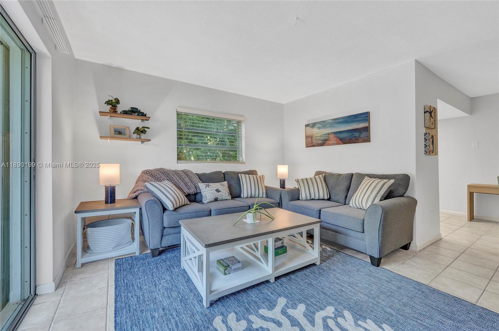 1129 Pebble Beach Lane, Unit 6 Marathon, FL 33050 - Photo 5 of 31 a living room with furniture and a painting on the wall