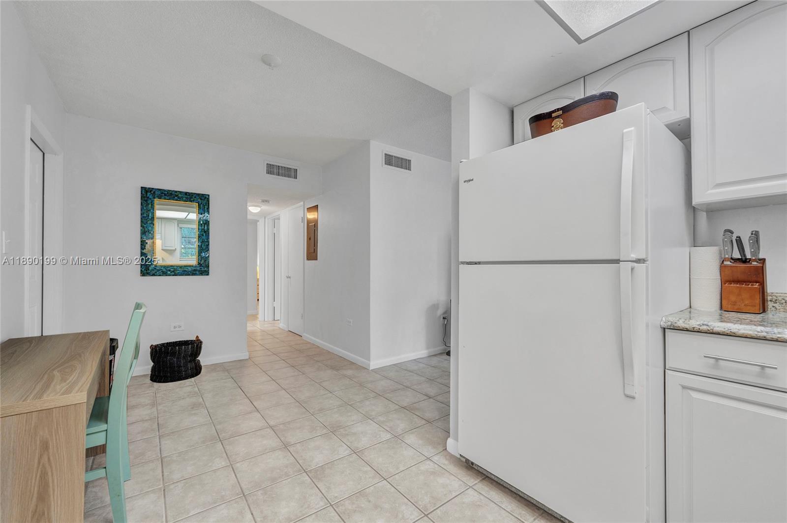 1129 Pebble Beach Lane, Unit 6 Marathon, FL 33050 - Photo 9 of 31 a white refrigerator freezer sitting in a kitchen