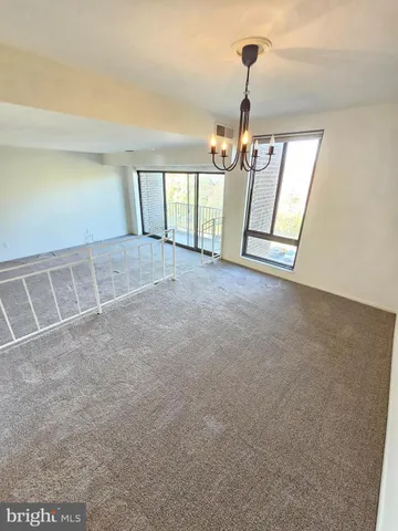 a kitchen with a stove top oven and cabinets