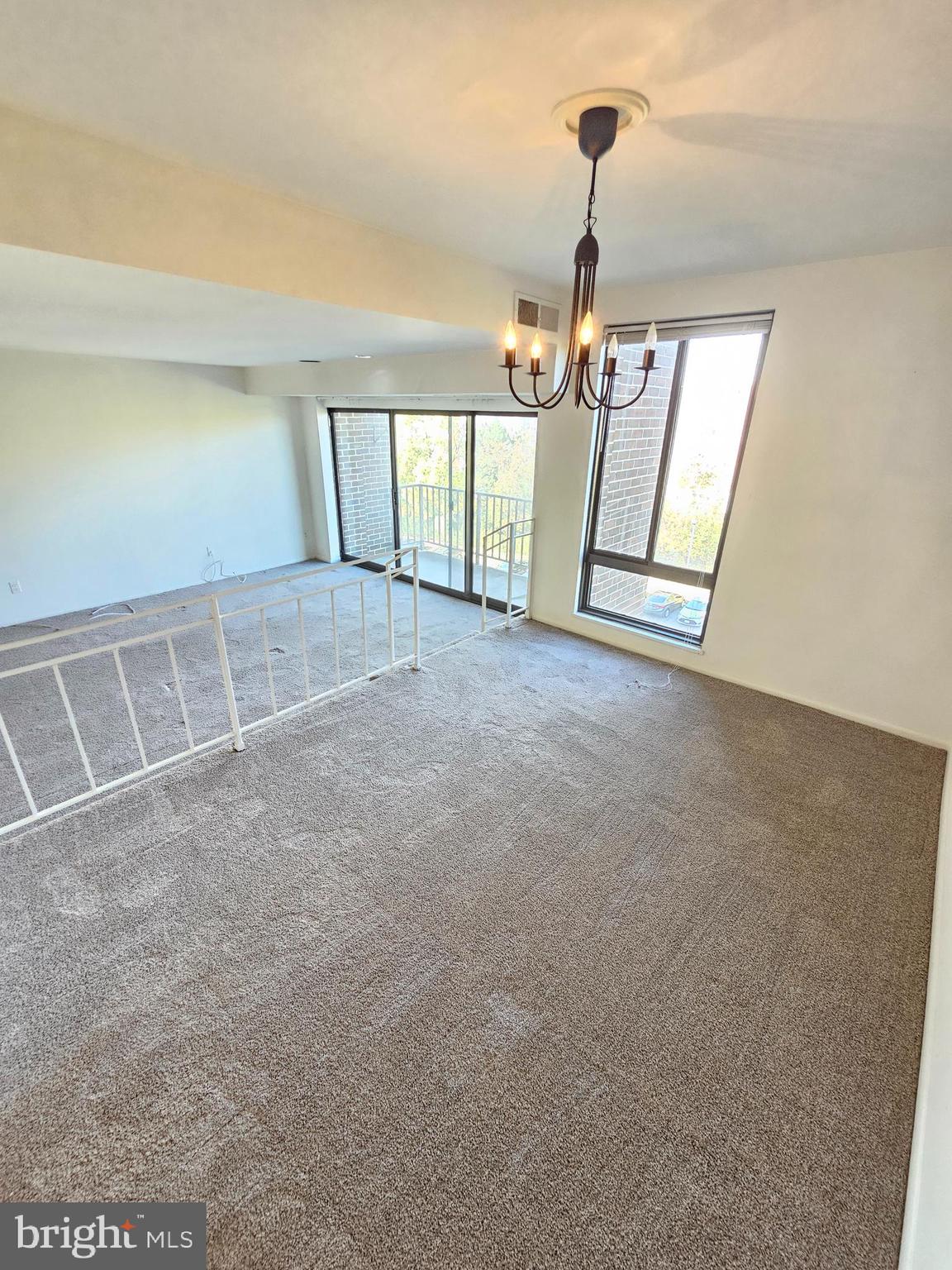 9900 Georgia Avenue, Unit 415 Silver Spring, MD 20902 - Photo 11 of 25 a view of empty room with windows