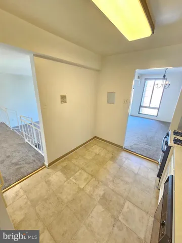 a bathroom with a toilet and a bathtub