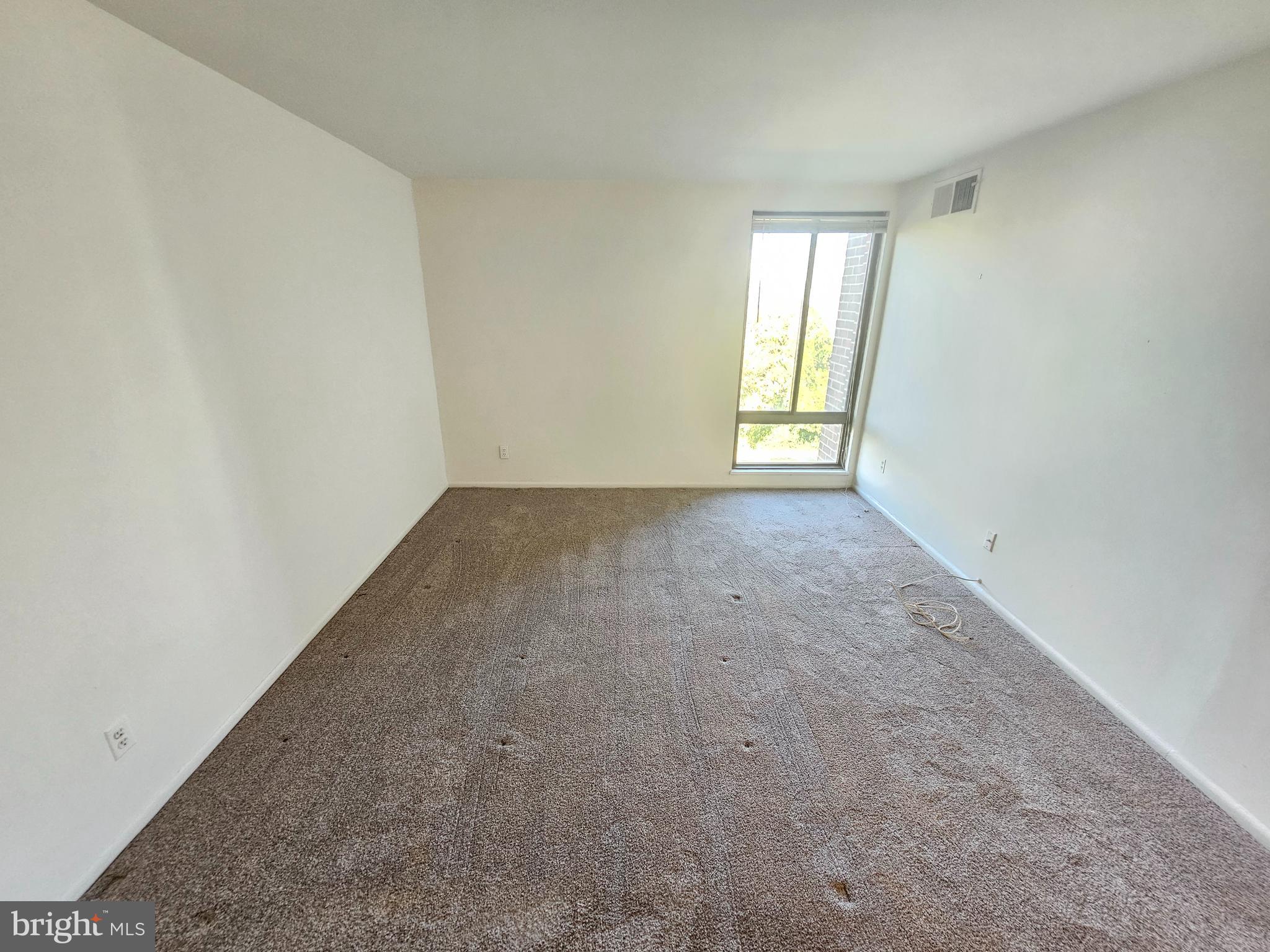 9900 Georgia Avenue, Unit 415 Silver Spring, MD 20902 - Photo 19 of 25 an empty room with windows