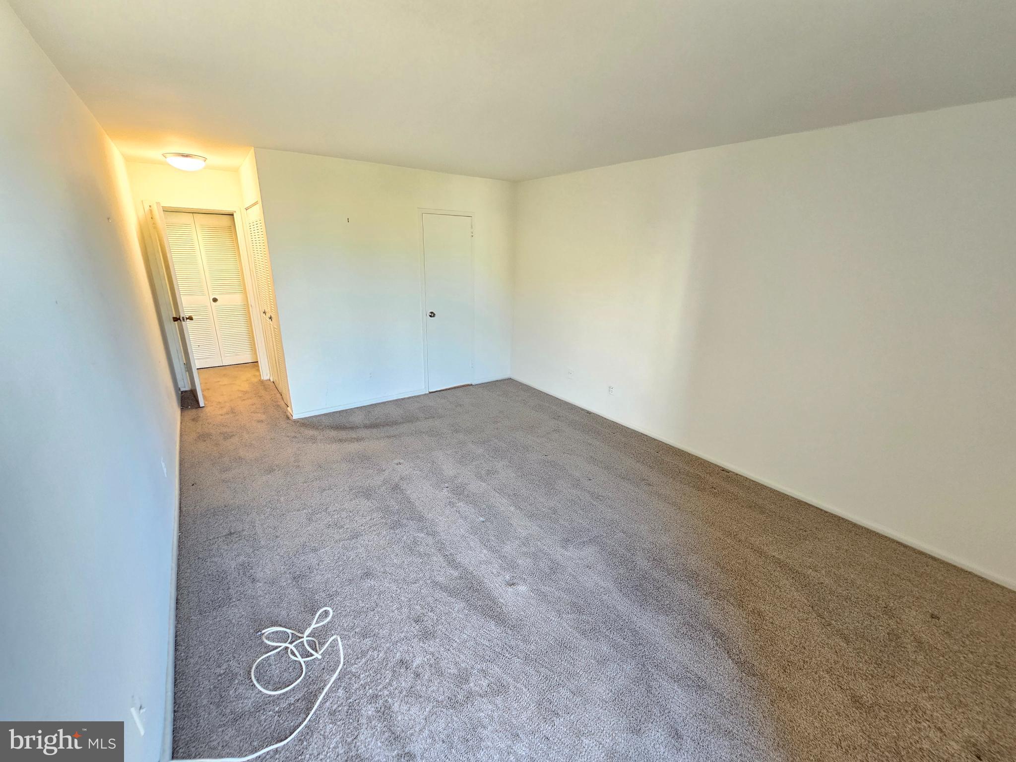 9900 Georgia Avenue, Unit 415 Silver Spring, MD 20902 - Photo 22 of 25 an empty room with a natural light
