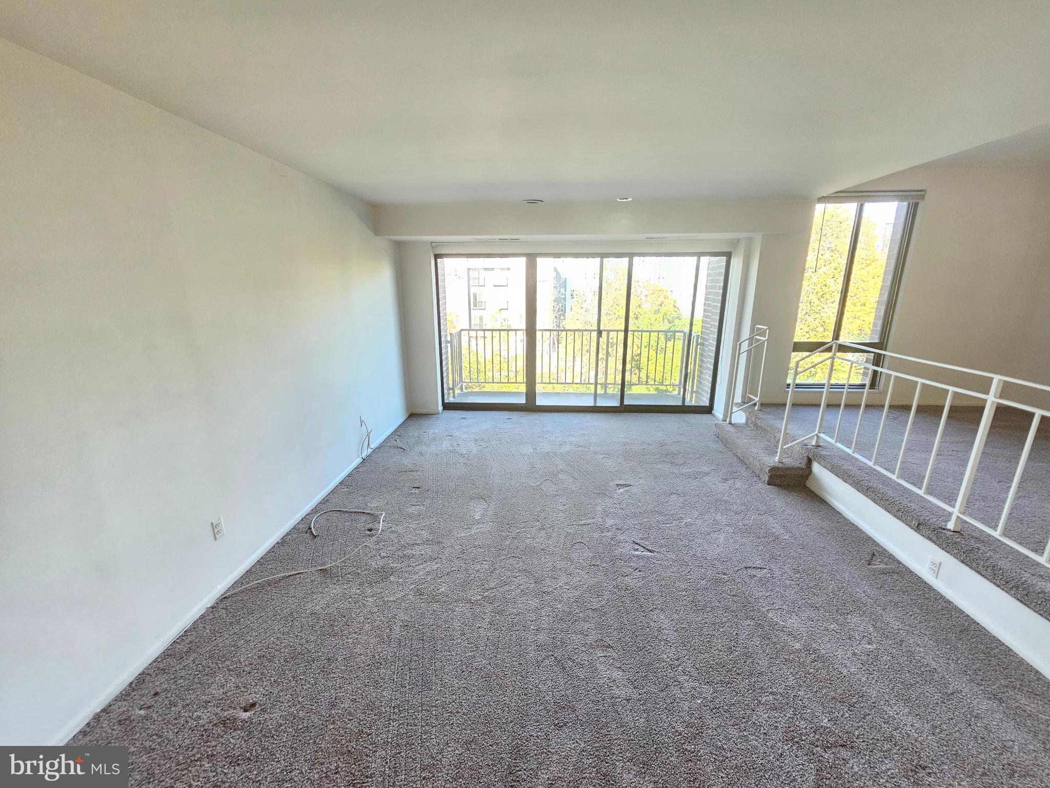 9900 Georgia Avenue, Unit 415 Silver Spring, MD 20902 - Photo 6 of 25 an empty room with windows