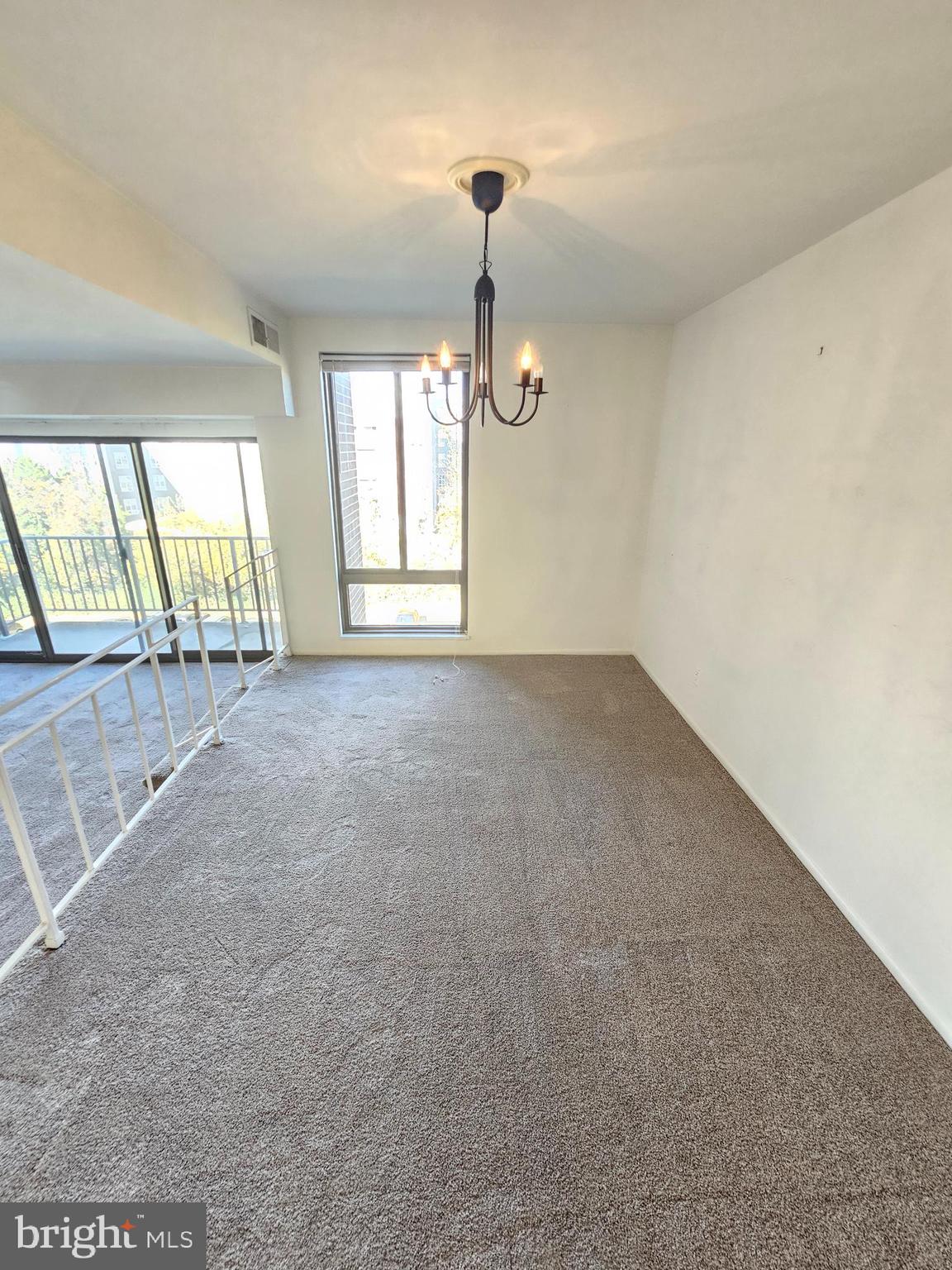9900 Georgia Avenue, Unit 415 Silver Spring, MD 20902 - Photo 10 of 25 a view of an empty room with a window
