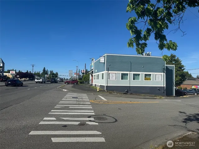 a front view of a house with a road
