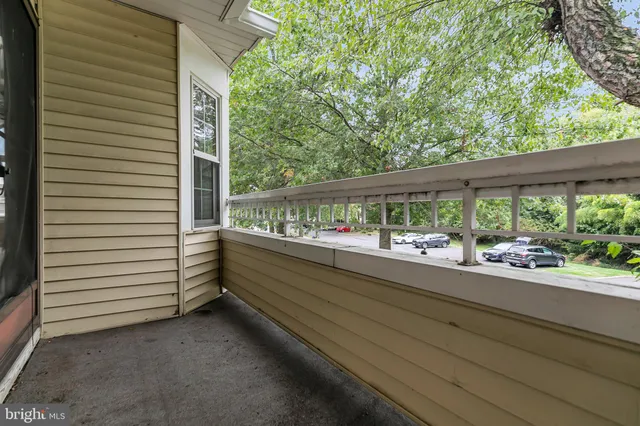 a balcony with a yard and an outdoor space