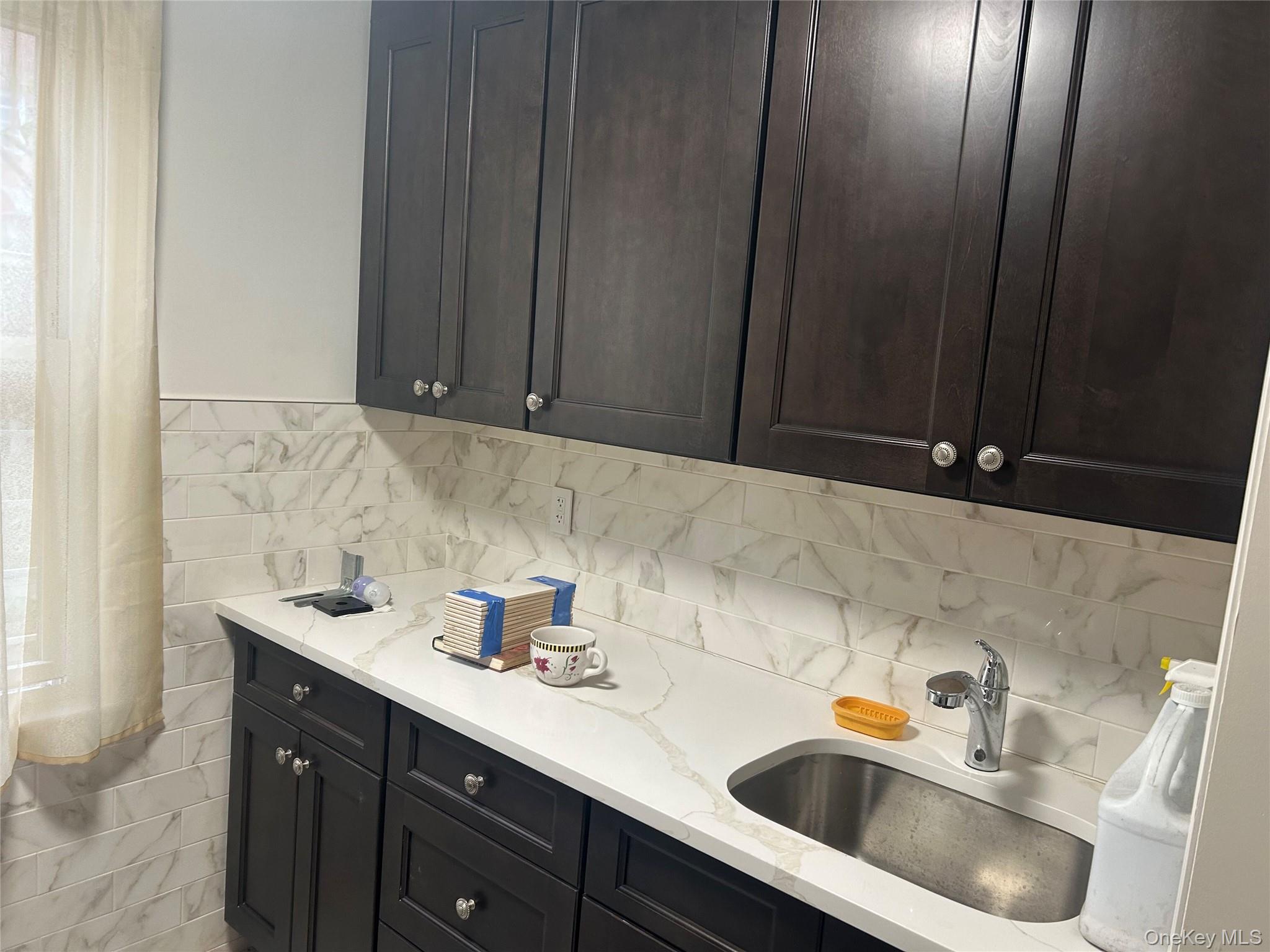 133-25 Blossom Avenue, Unit 1 Queens, NY 11355 - Photo 2 of 8 Kitchen with light stone counters