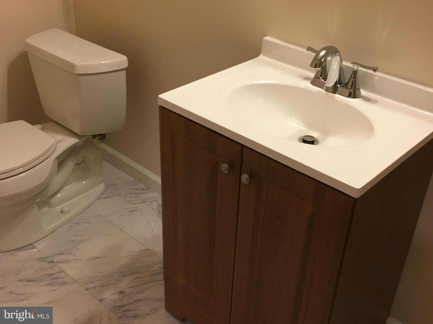 12205 Pleasant Prospect Bowie, MD 20721 - Photo 11 of 30 a bathroom with a sink toilet and vanity