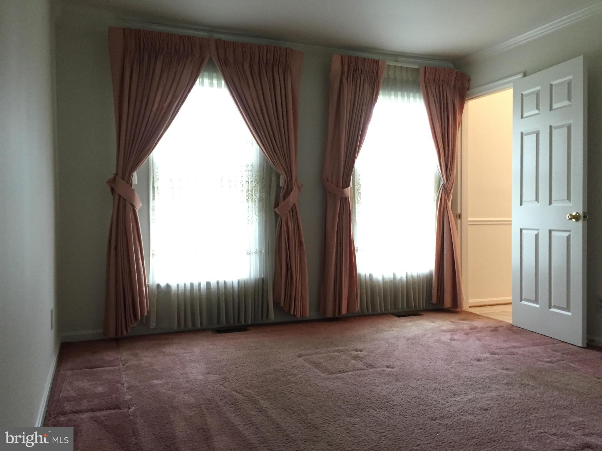 12205 Pleasant Prospect Bowie, MD 20721 - Photo 12 of 30 an empty room with a window and doors