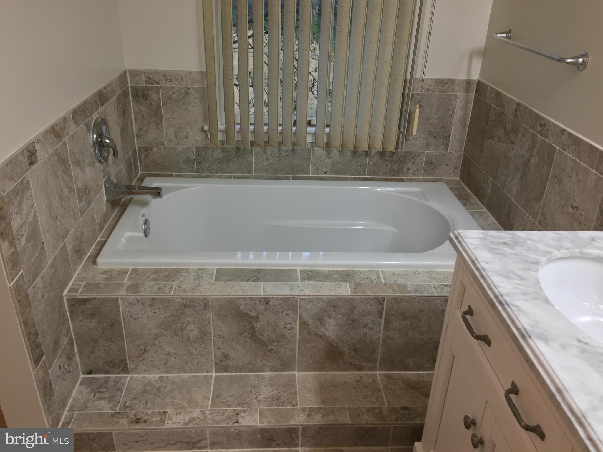 12205 Pleasant Prospect Bowie, MD 20721 - Photo 15 of 30 a bath tub sitting next to a shower