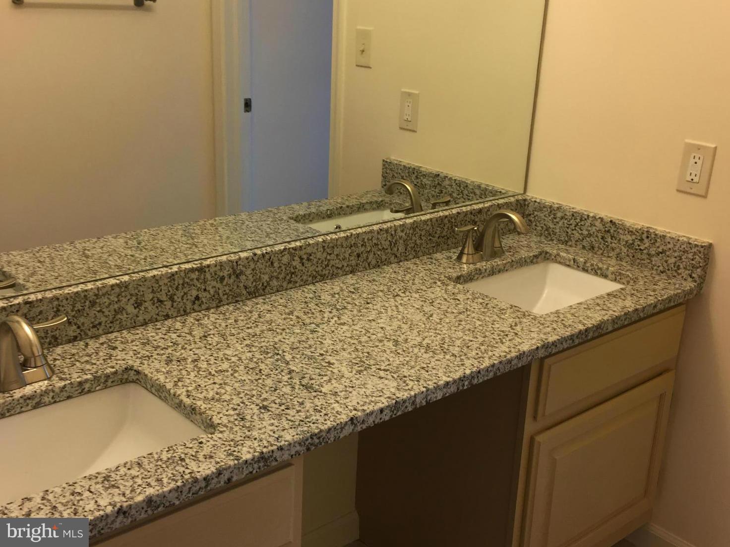 12205 Pleasant Prospect Bowie, MD 20721 - Photo 21 of 30 a bathroom with a granite countertop sink and a mirror