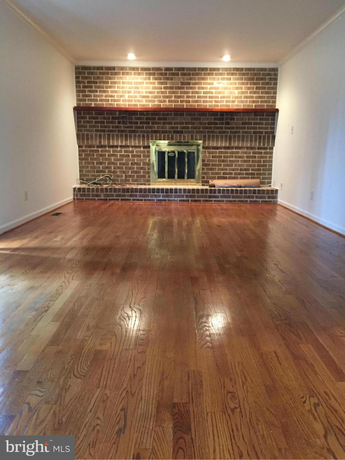 12205 Pleasant Prospect Bowie, MD 20721 - Photo 10 of 30 a view of an empty room with wooden floor