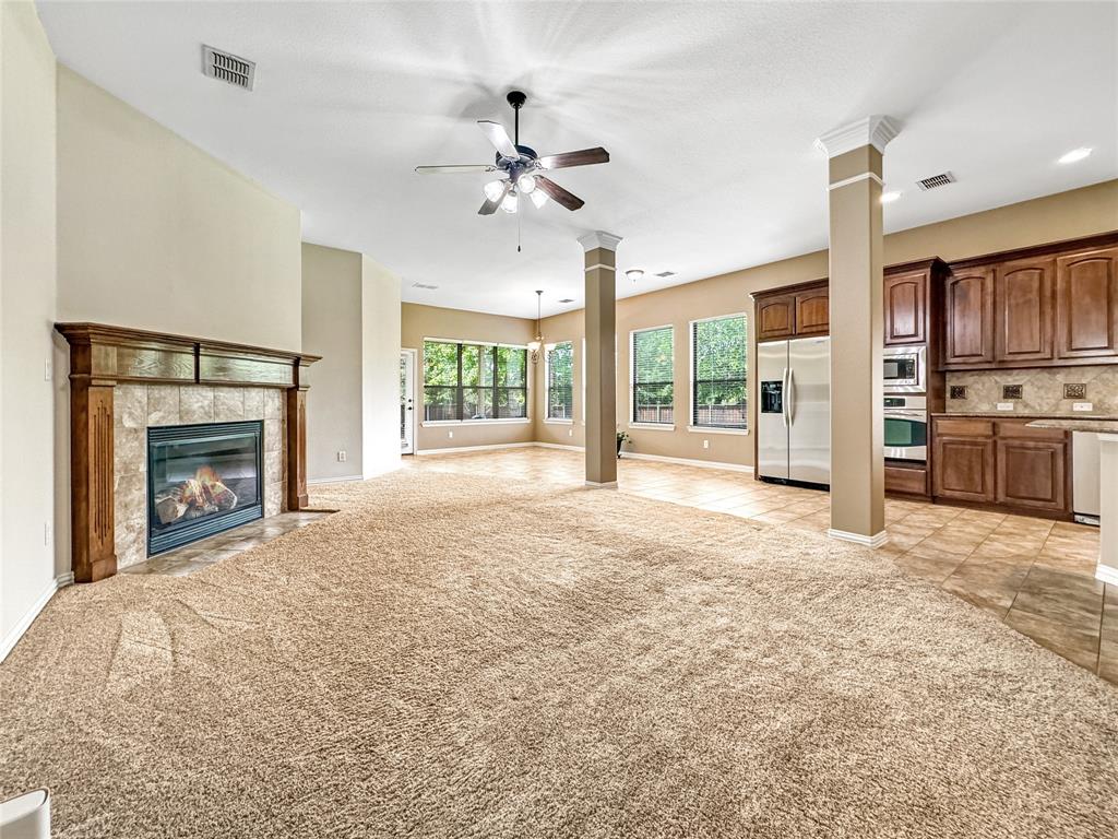 401 Varnum Way Fairview, TX 75069 - Photo 11 of 33 a view of an empty room with a fireplace and a window