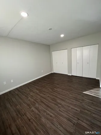 a view of room with wooden floor