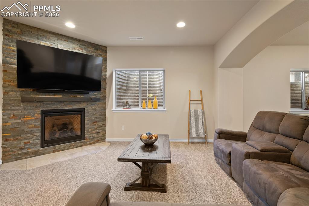 3718 Sky Rim Court Colorado Springs, CO 80908 - Photo 35 of 49 Lower level family room with gas fireplace.