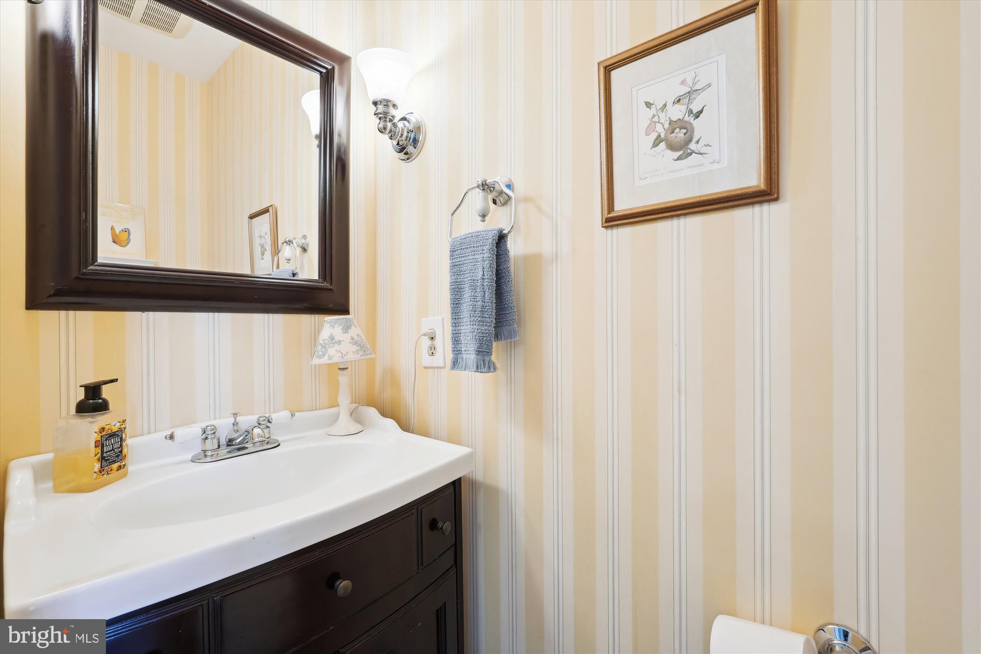 18244 Fox Chase Circle Olney, MD 20832 - Photo 16 of 26 a bathroom with a sink and a mirror
