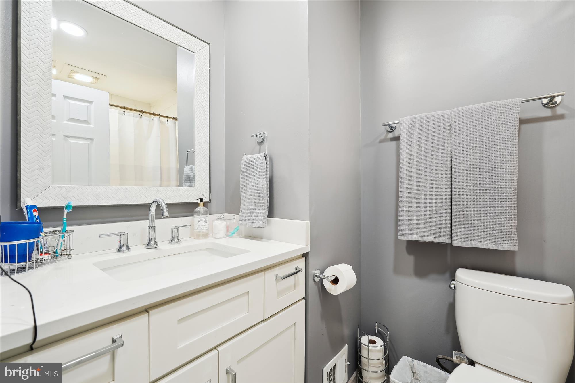 18244 Fox Chase Circle Olney, MD 20832 - Photo 17 of 26 a bathroom with a sink and a mirror