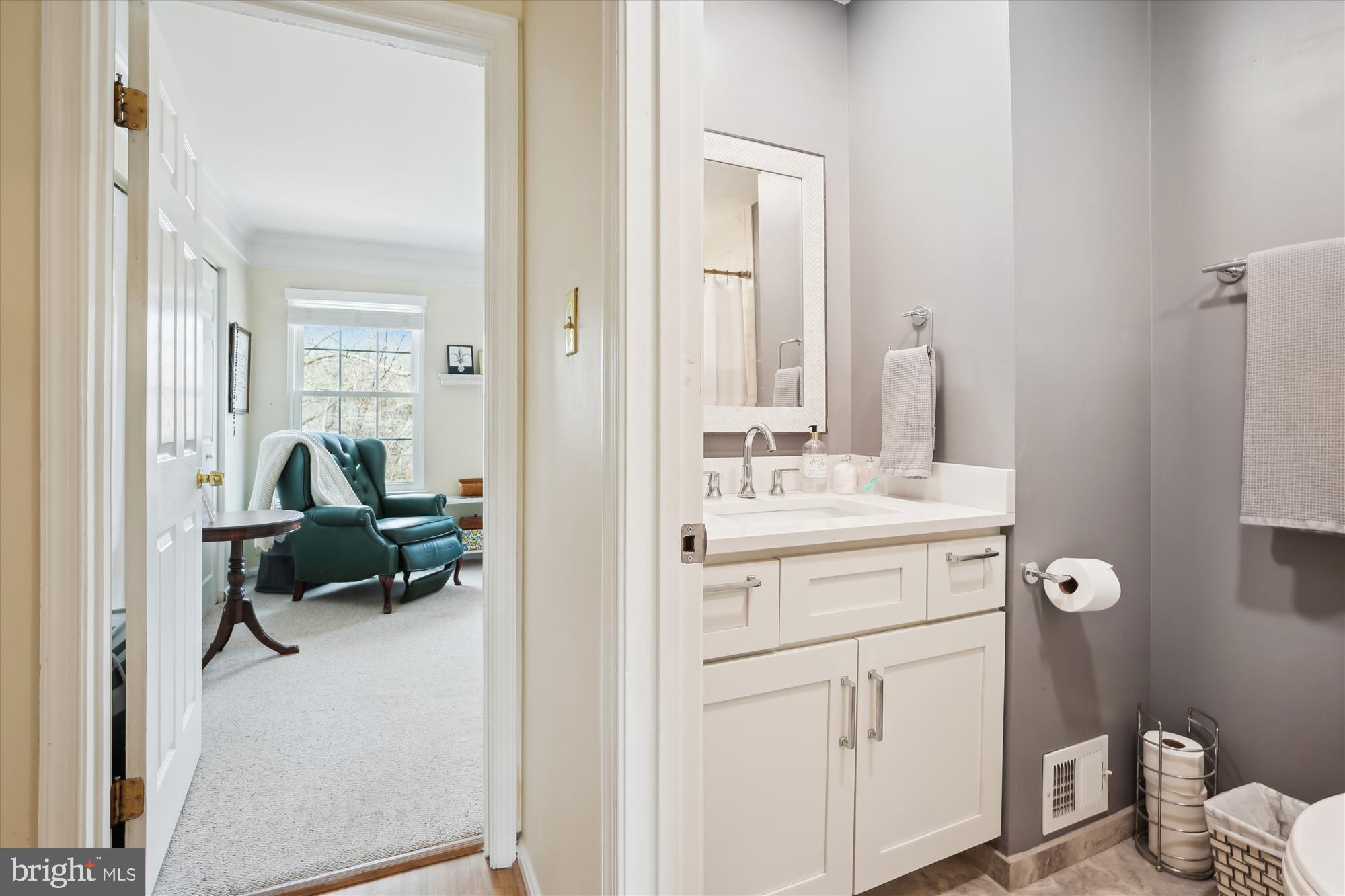 18244 Fox Chase Circle Olney, MD 20832 - Photo 18 of 26 a en suite bathroom with a sink a mirror and a toilet