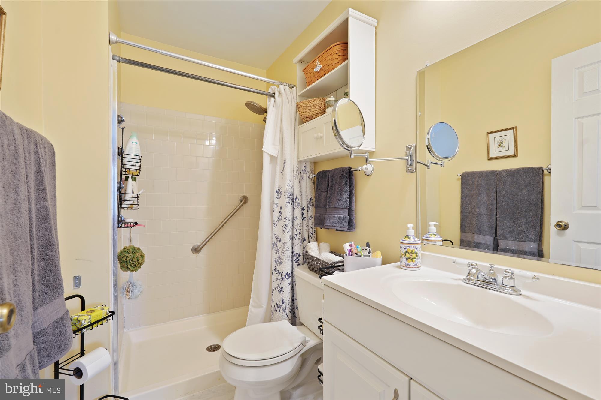 18244 Fox Chase Circle Olney, MD 20832 - Photo 23 of 26 a bathroom with a sink a toilet and shower