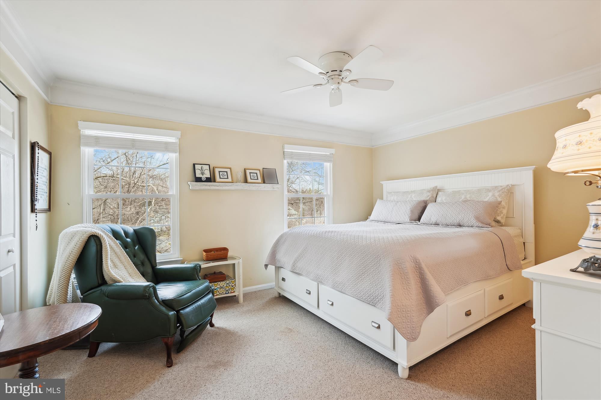 18244 Fox Chase Circle Olney, MD 20832 - Photo 25 of 26 a spacious bedroom with a bed and a couch