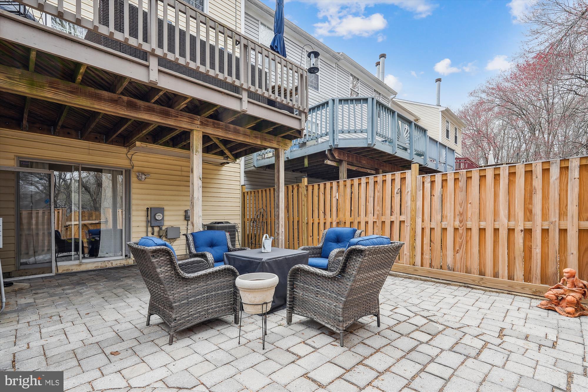 18244 Fox Chase Circle Olney, MD 20832 - Photo 4 of 26 a patio with patio couch and wooden fence