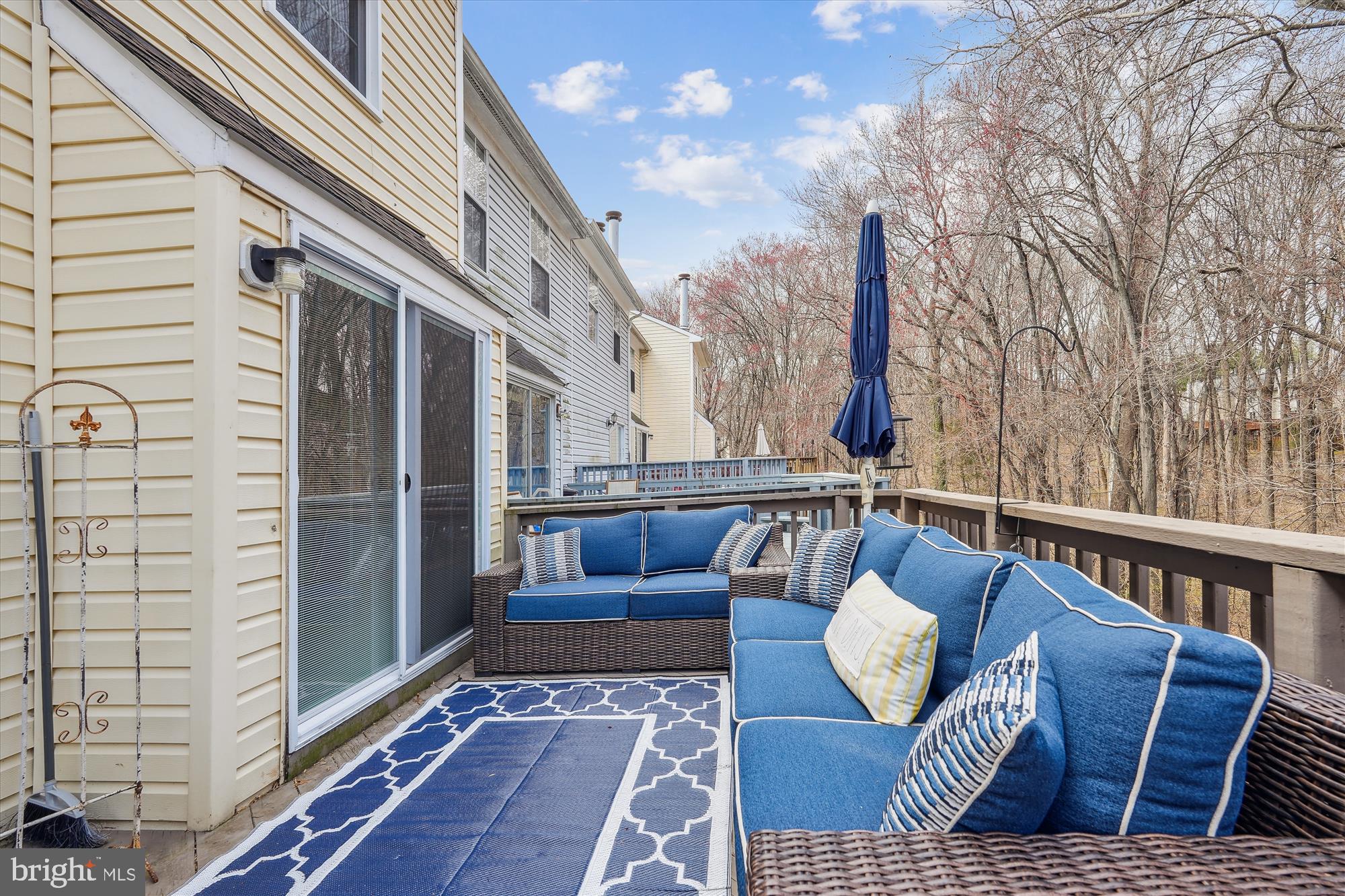 18244 Fox Chase Circle Olney, MD 20832 - Photo 7 of 26 a view of balcony with couch and wooden floor
