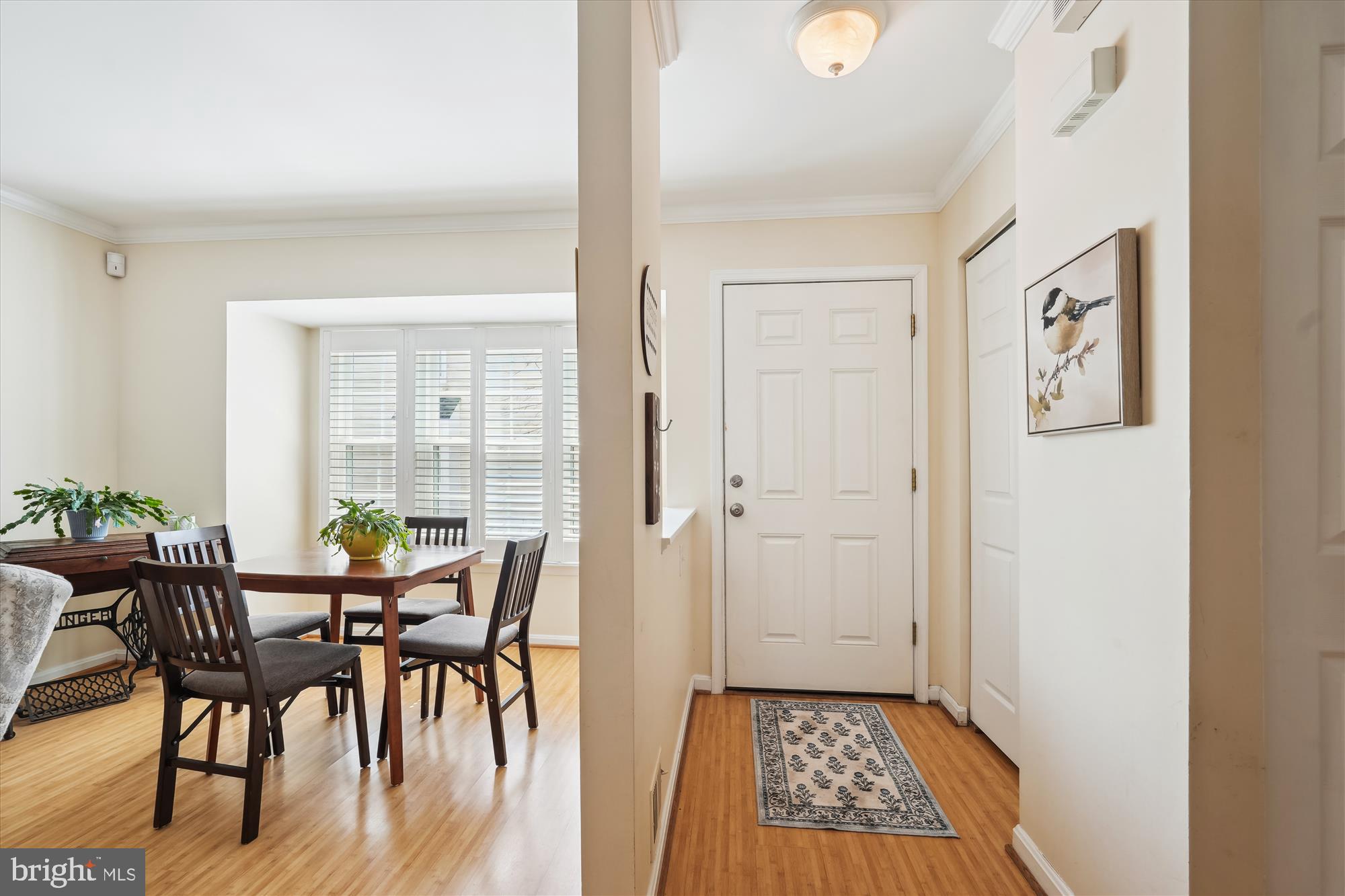 18244 Fox Chase Circle Olney, MD 20832 - Photo 10 of 26 a view of a dining room with furniture and wooden floor