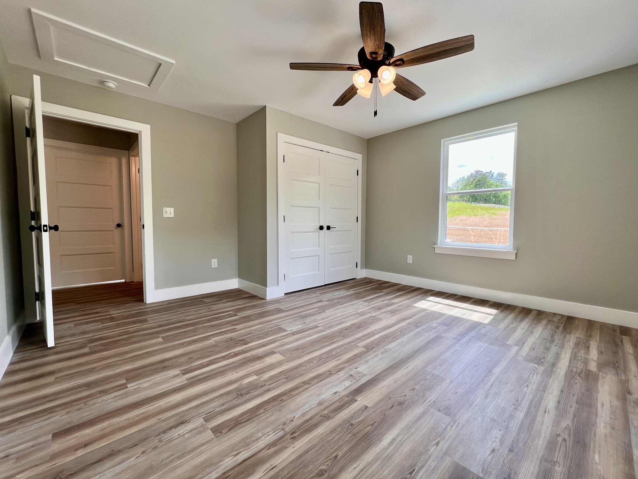417 Defeated Creek Highway Carthage, TN 37030 - Photo 14 of 30 wooden floor in an empty room with a window