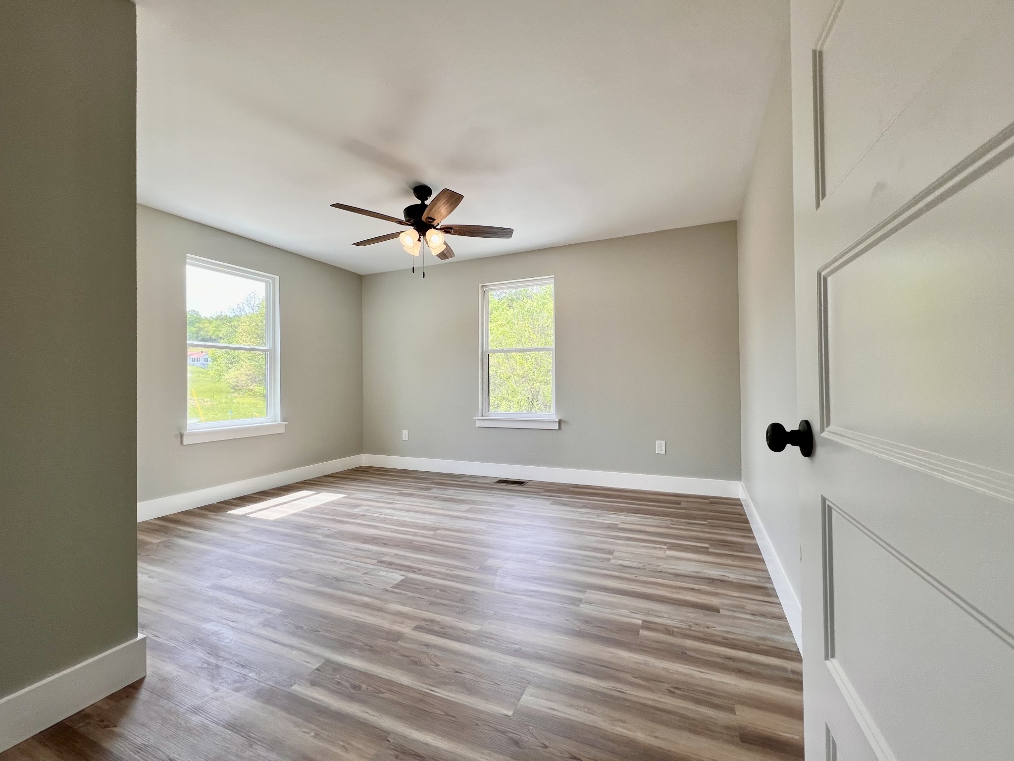417 Defeated Creek Highway Carthage, TN 37030 - Photo 15 of 30 a view of an empty room with wooden floor and a window