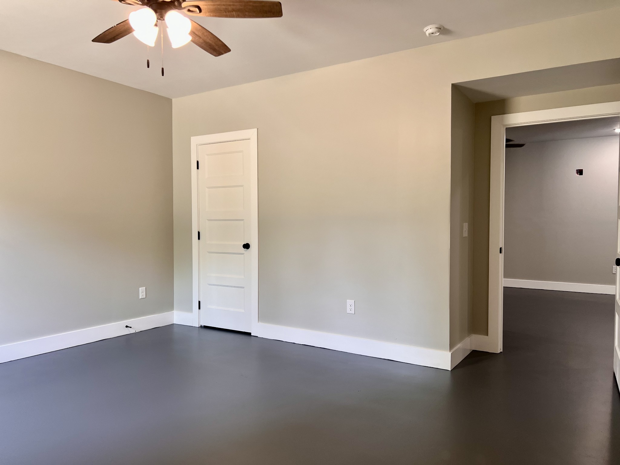 417 Defeated Creek Highway Carthage, TN 37030 - Photo 23 of 30 an empty room with a ceiling fan and wooden floor