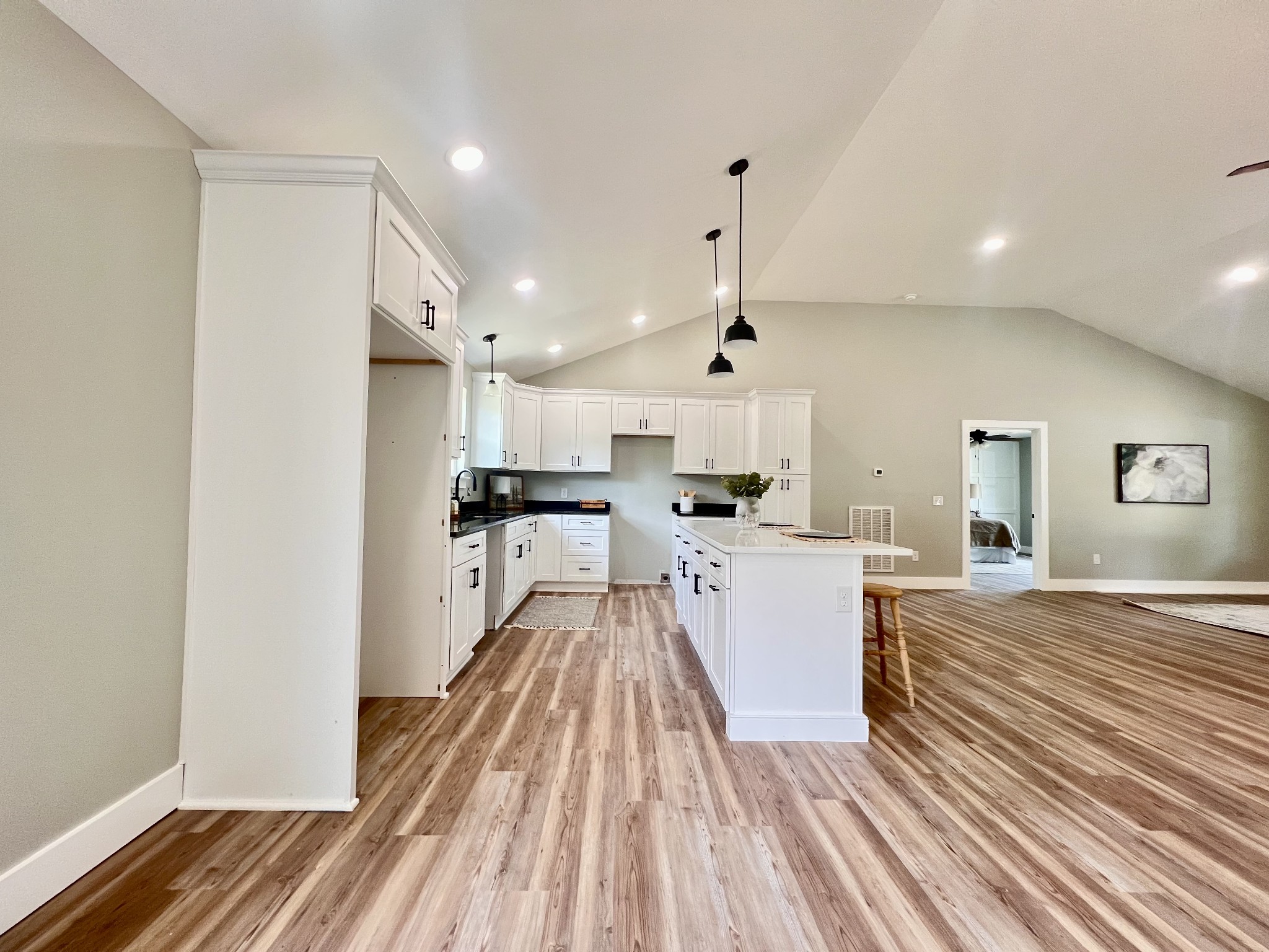 417 Defeated Creek Highway Carthage, TN 37030 - Photo 4 of 30 a large white kitchen with kitchen island a stove a sink and a refrigerator