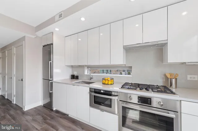 a kitchen with a stove and a refrigerator