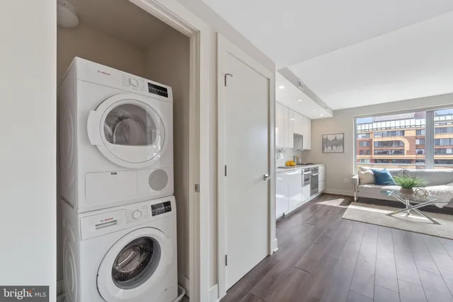 a view of a hallway with washer and dryer