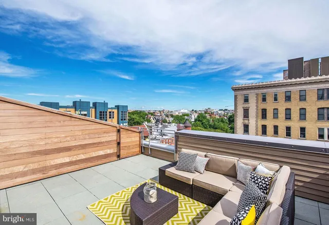 a view of swimming pool with seating area
