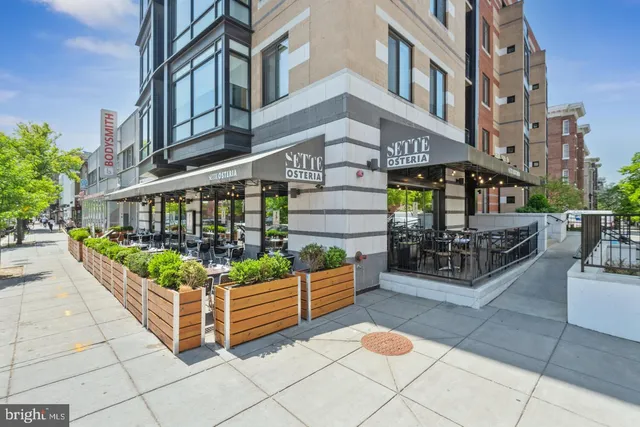 a view of a building with sitting area