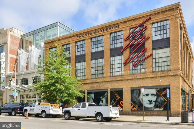 a front view of a building with large windows