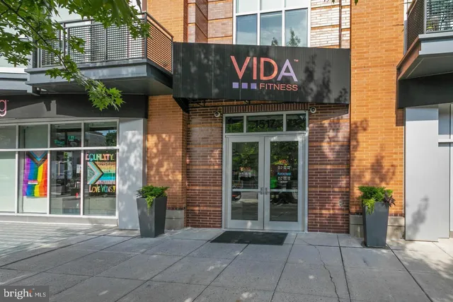 a lobby with furniture and a chandelier