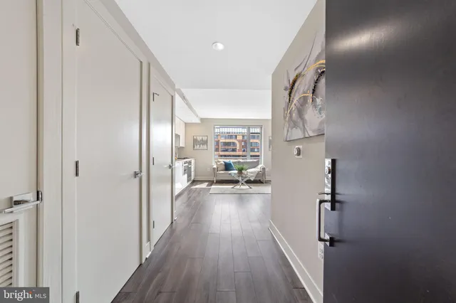 a view of hallway with wooden floor