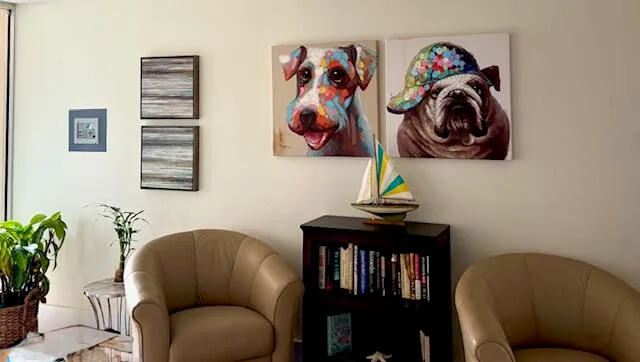 a living room with furniture and a chair