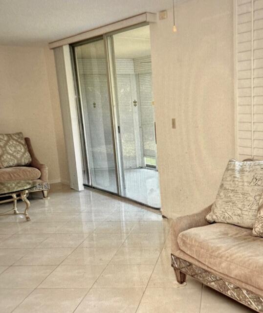 6100 Northwest 2nd Avenue, Unit 129 Boca Raton, FL 33487 - Photo 7 of 9 a living room with furniture and a rug