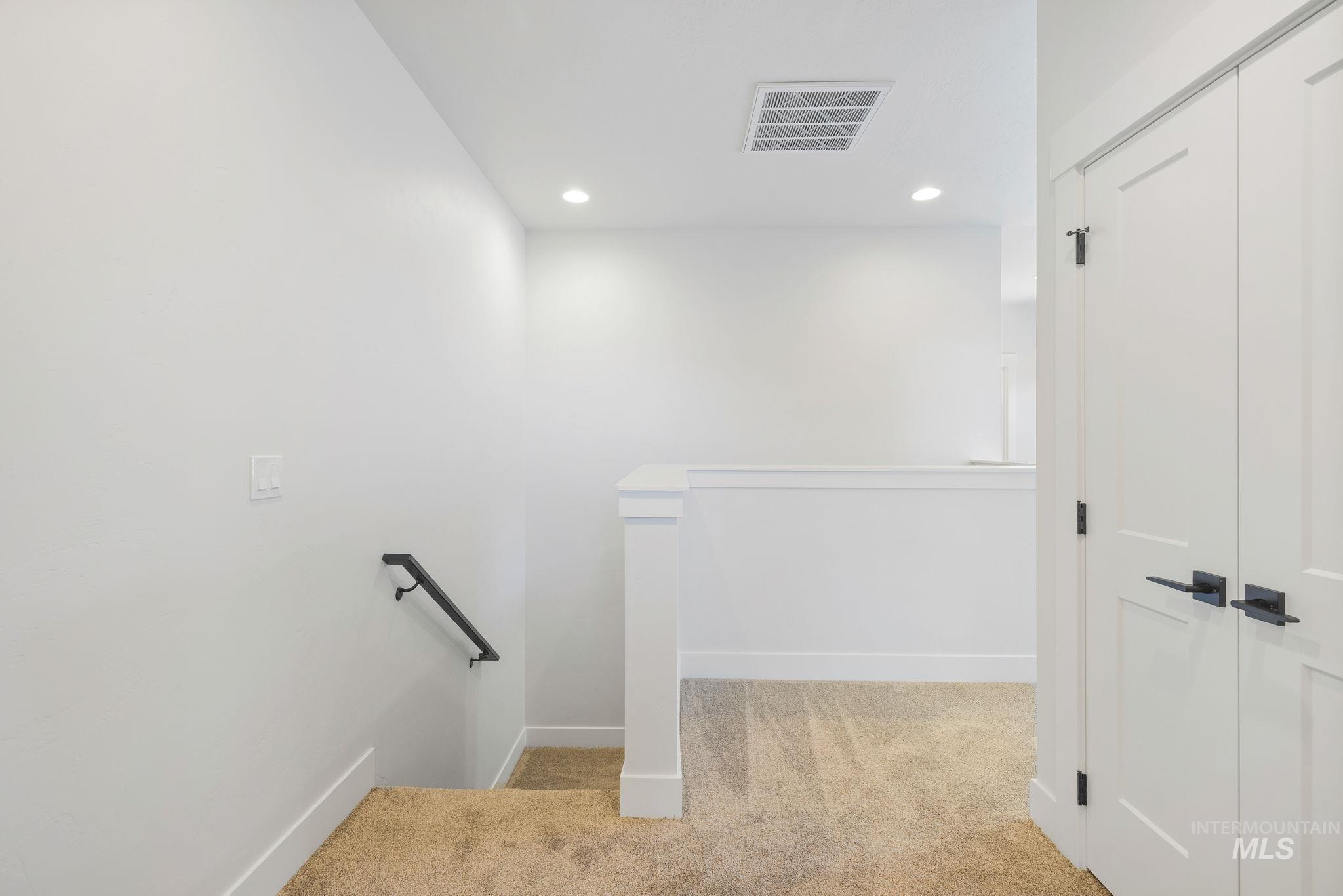 18 Ogden Street Cascade, ID 83611 - Photo 25 of 39 Stairway with carpet flooring and recessed lighting