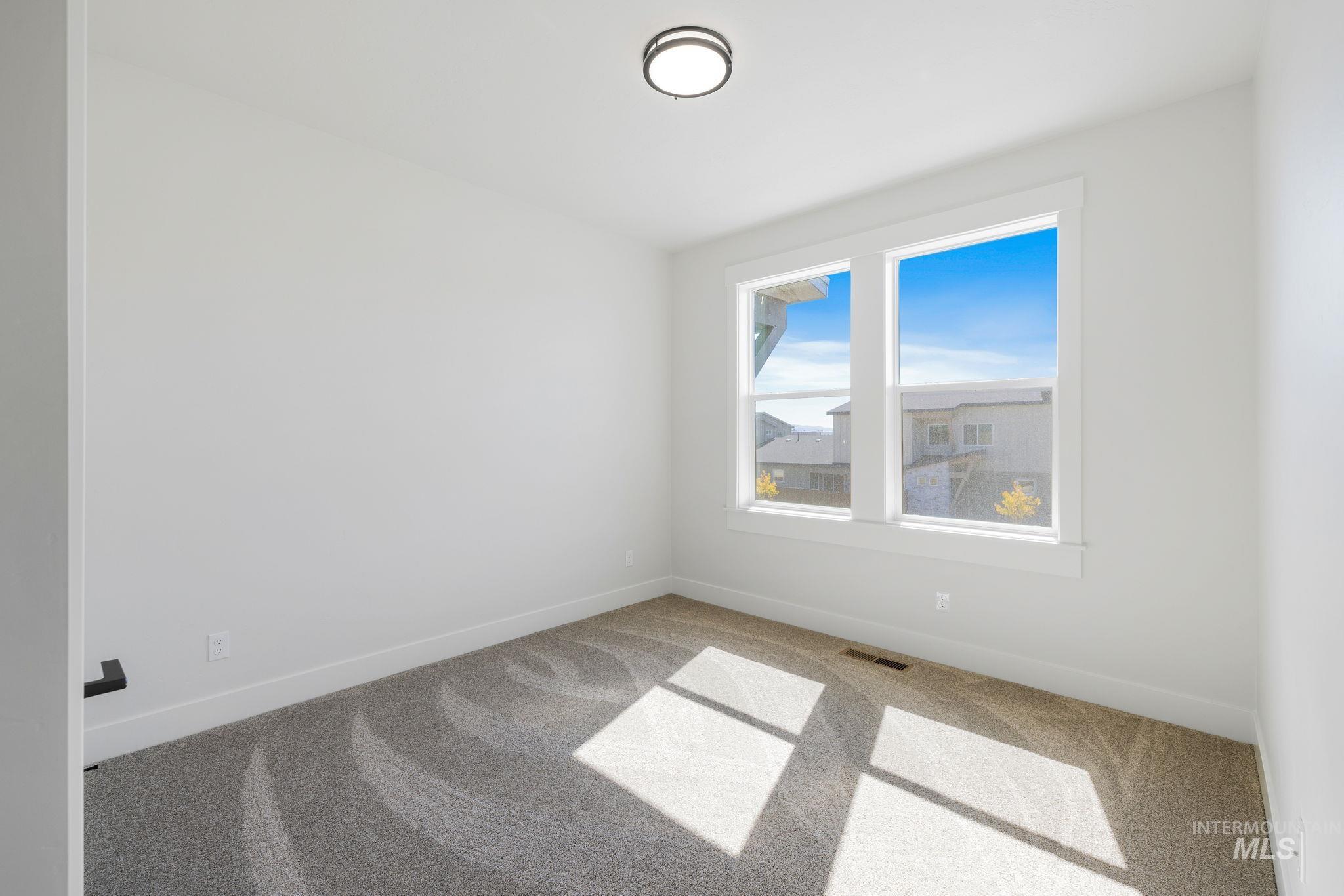 18 Ogden Street Cascade, ID 83611 - Photo 29 of 39 Empty room featuring carpet