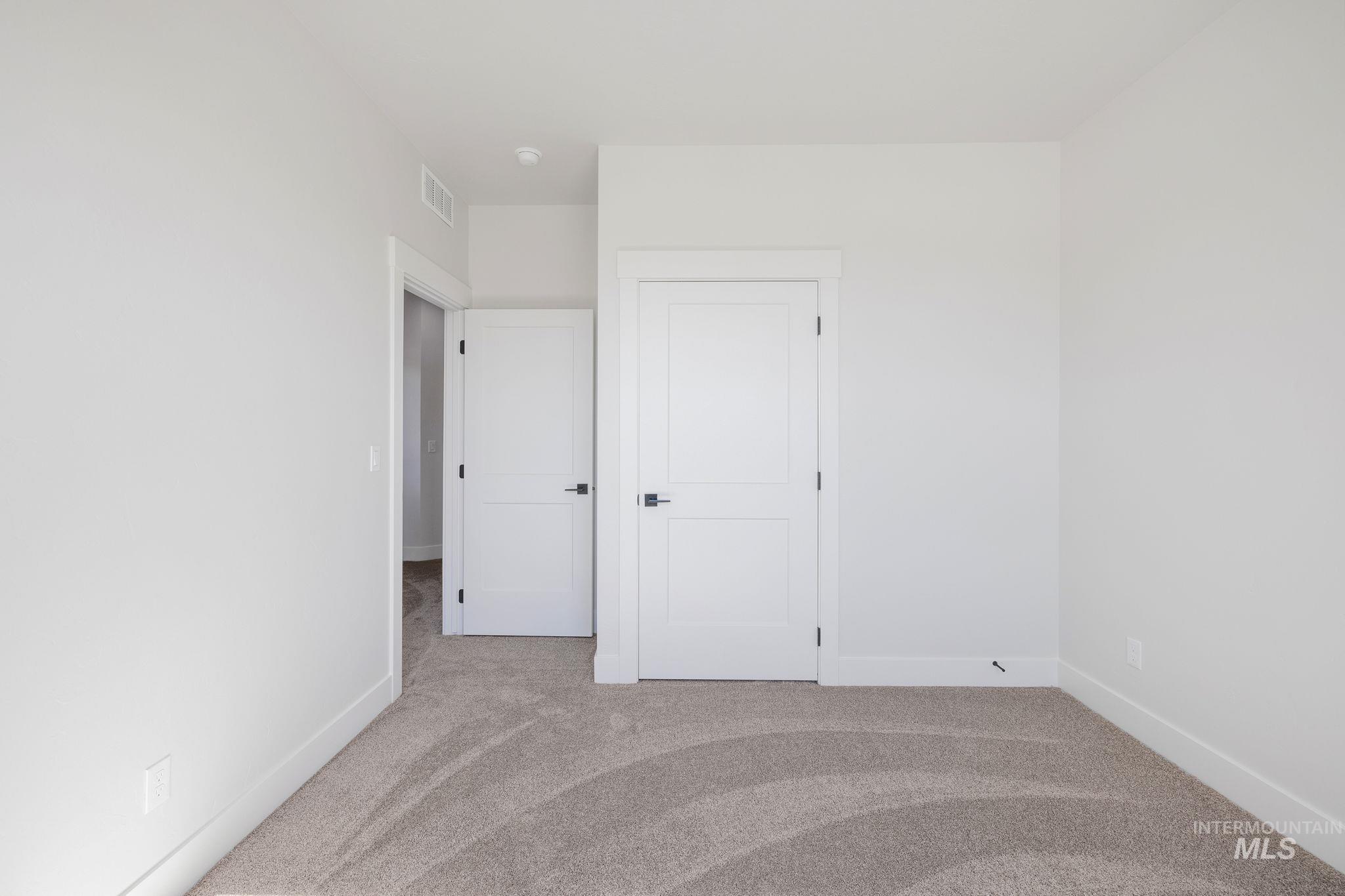 18 Ogden Street Cascade, ID 83611 - Photo 30 of 39 Unfurnished bedroom featuring light carpet