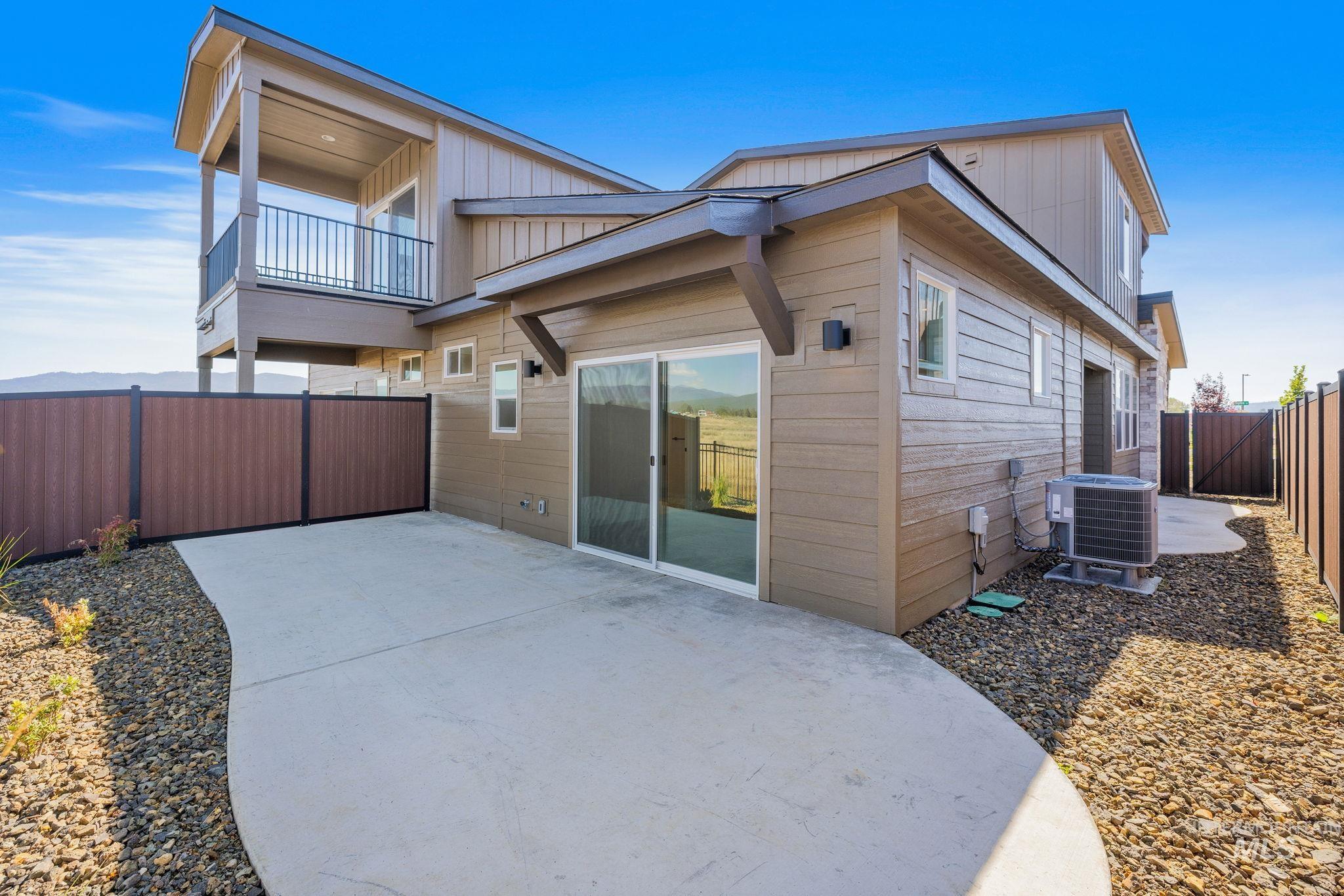 18 Ogden Street Cascade, ID 83611 - Photo 36 of 39 Rear view of property featuring a fenced backyard, a patio area, and a balcony